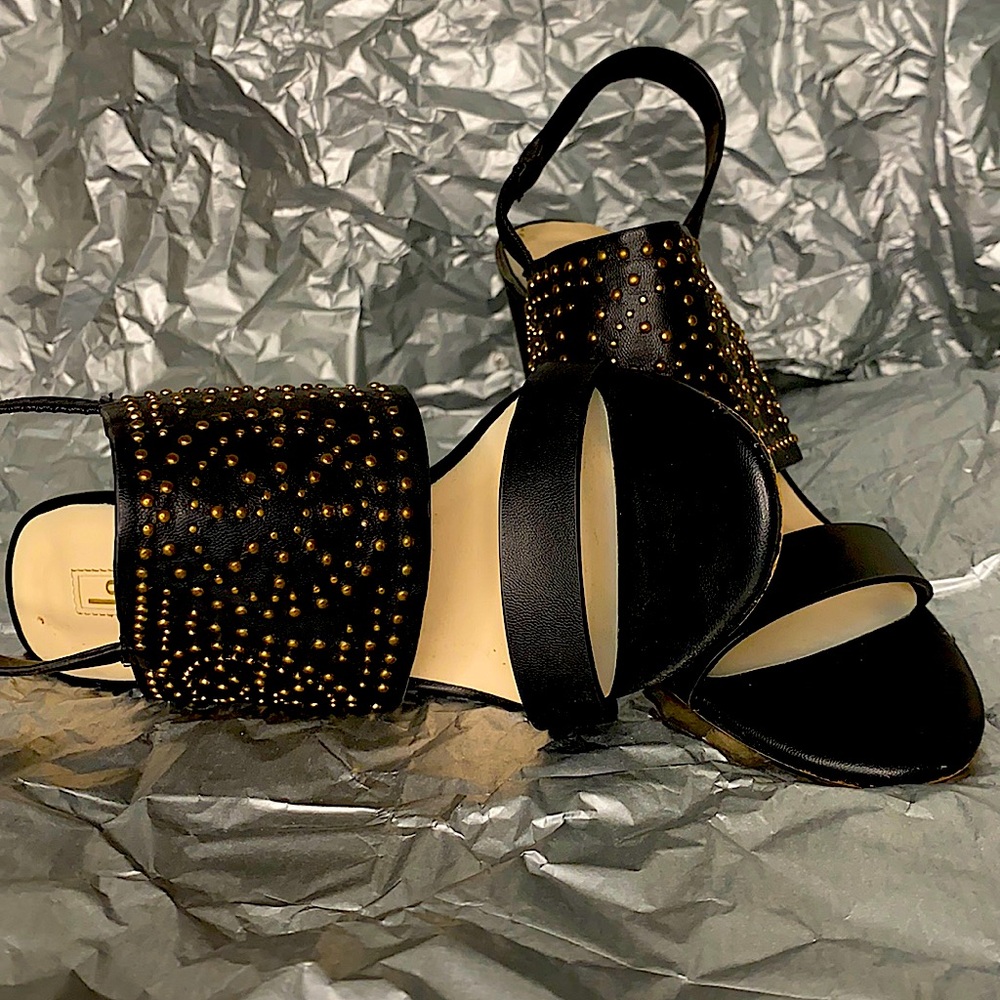 Edgy black heels. Worn a couple of times, small scrapes on heels.